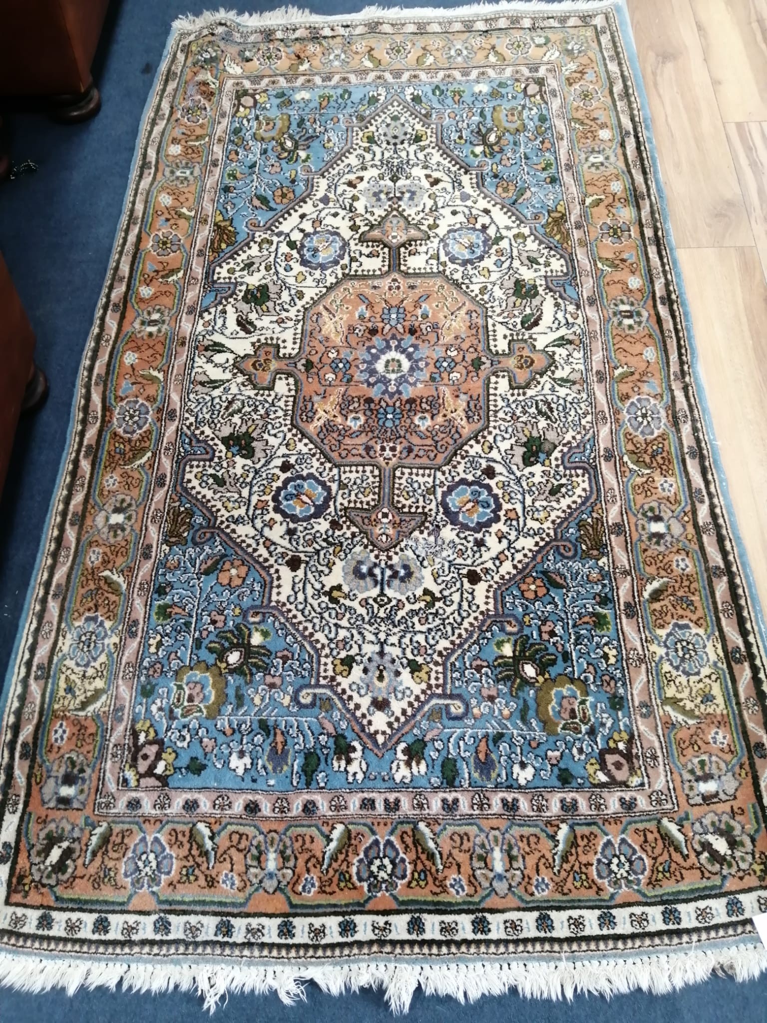 A North West Persian ivory ground rug, 184 x 104cm